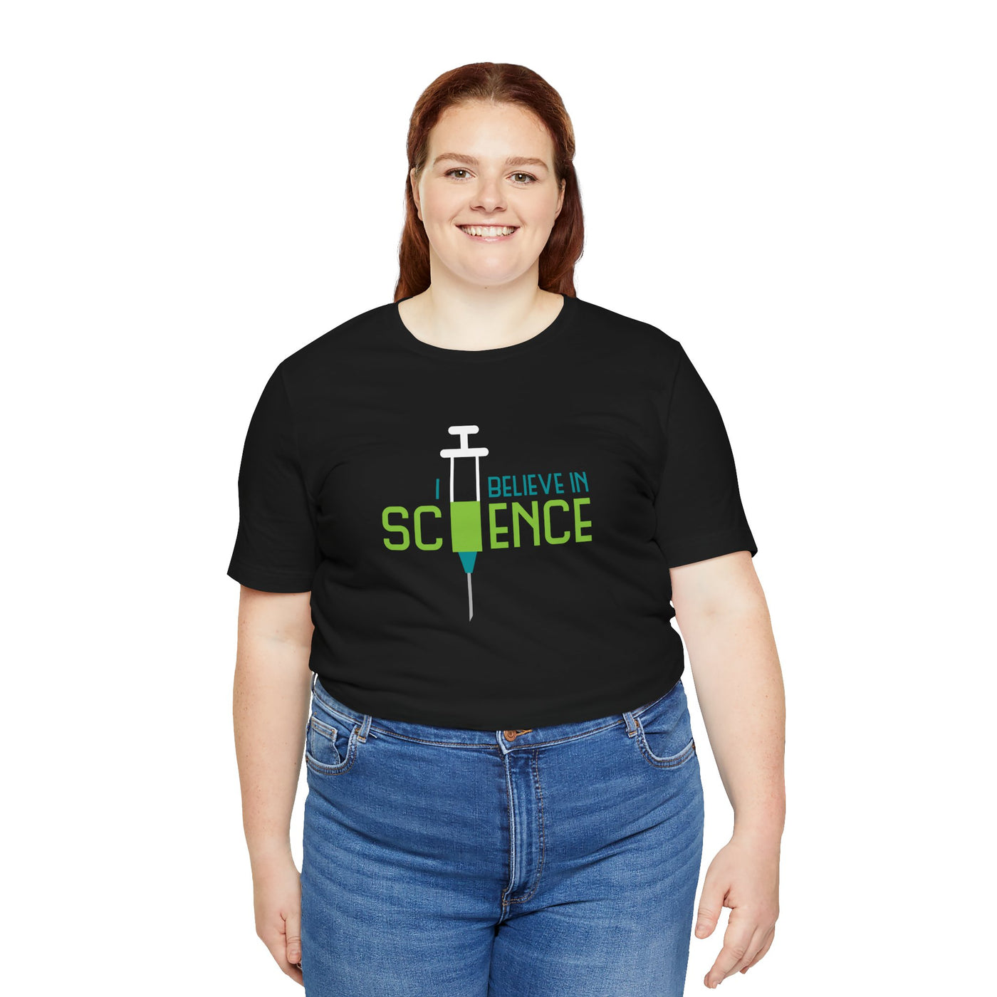 Person wearing a black t-shirt with 'I Believe in Science' text and syringe graphic 