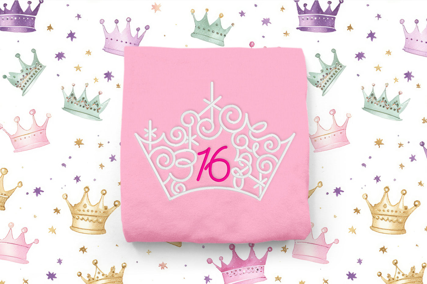 Pink fabric with a white tiara and number 16 design on a background of colorful crowns and stars.