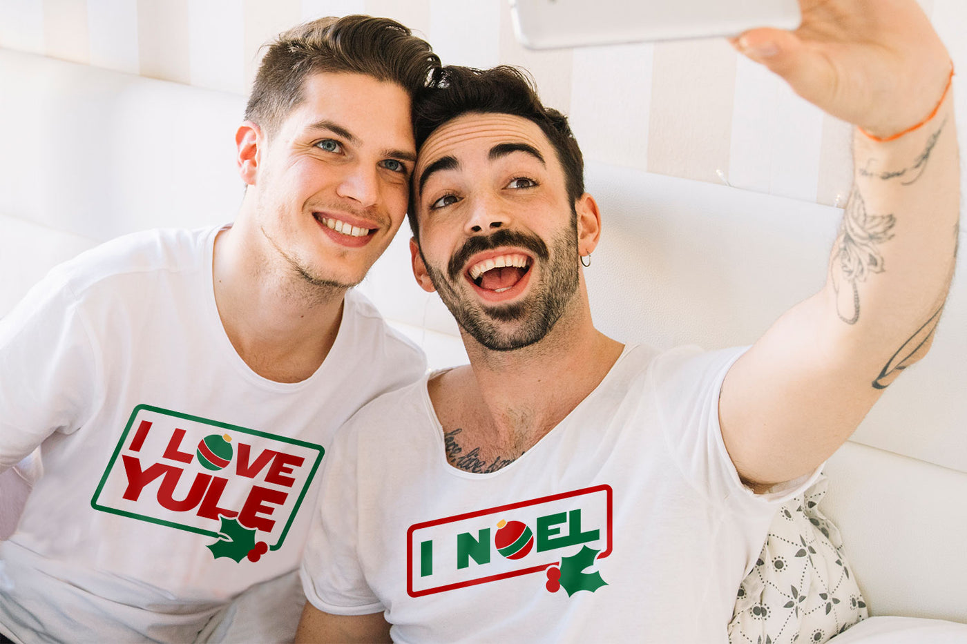 A couple wearing Christmas-themed t-shirts with 'I Love Yule' and 'I Noel' SVG designs.