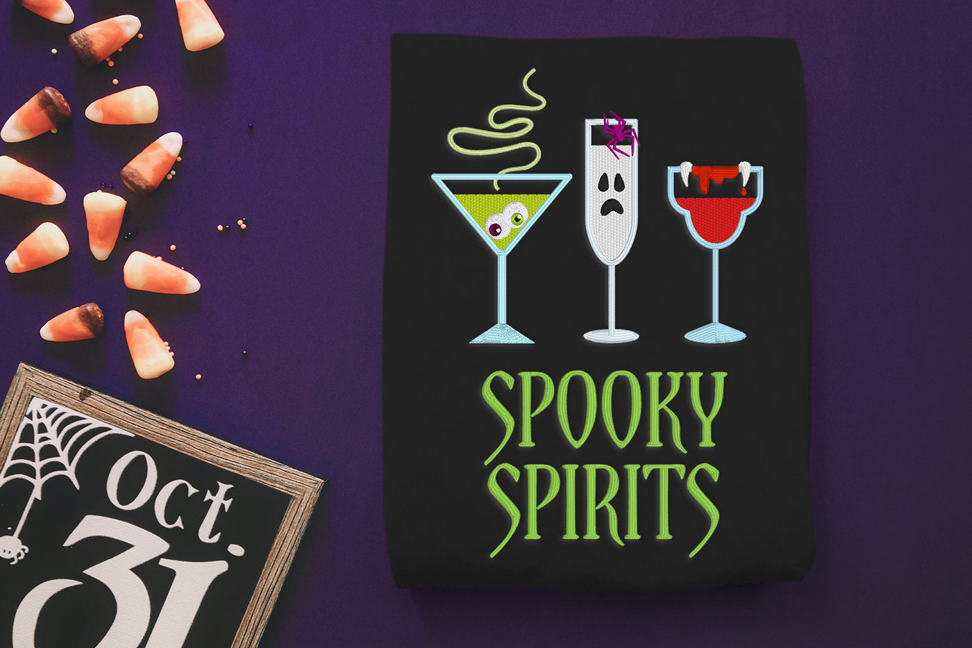 Halloween-themed embroidery design with cocktails and 'Spooky Spirits' text on a black background.