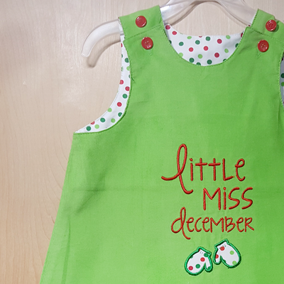 Little Miss December applique design with mittens.