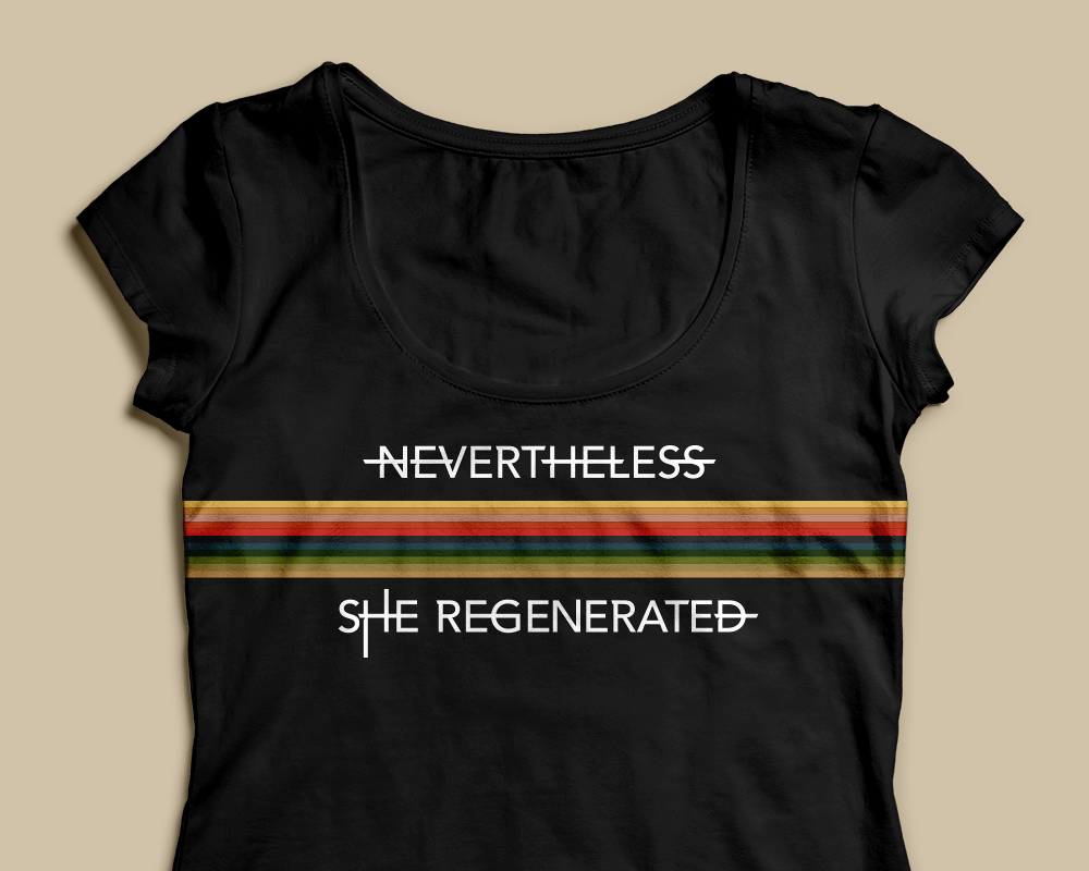 A black scoopneck shirt with a band of horizontal multicolored stripes. Above and below the stripes is the phrase "Nevertheless she regenerated" in white.