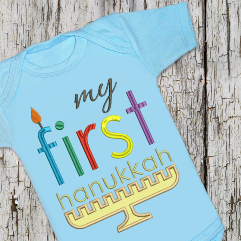 Applique design of a menorah that says "my first hanukkah."The F looks like a candle.