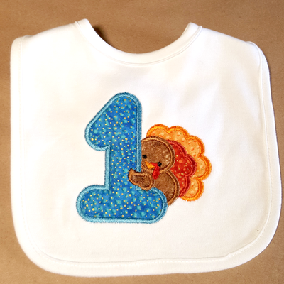 Large applique 1 with a turkey behind it.