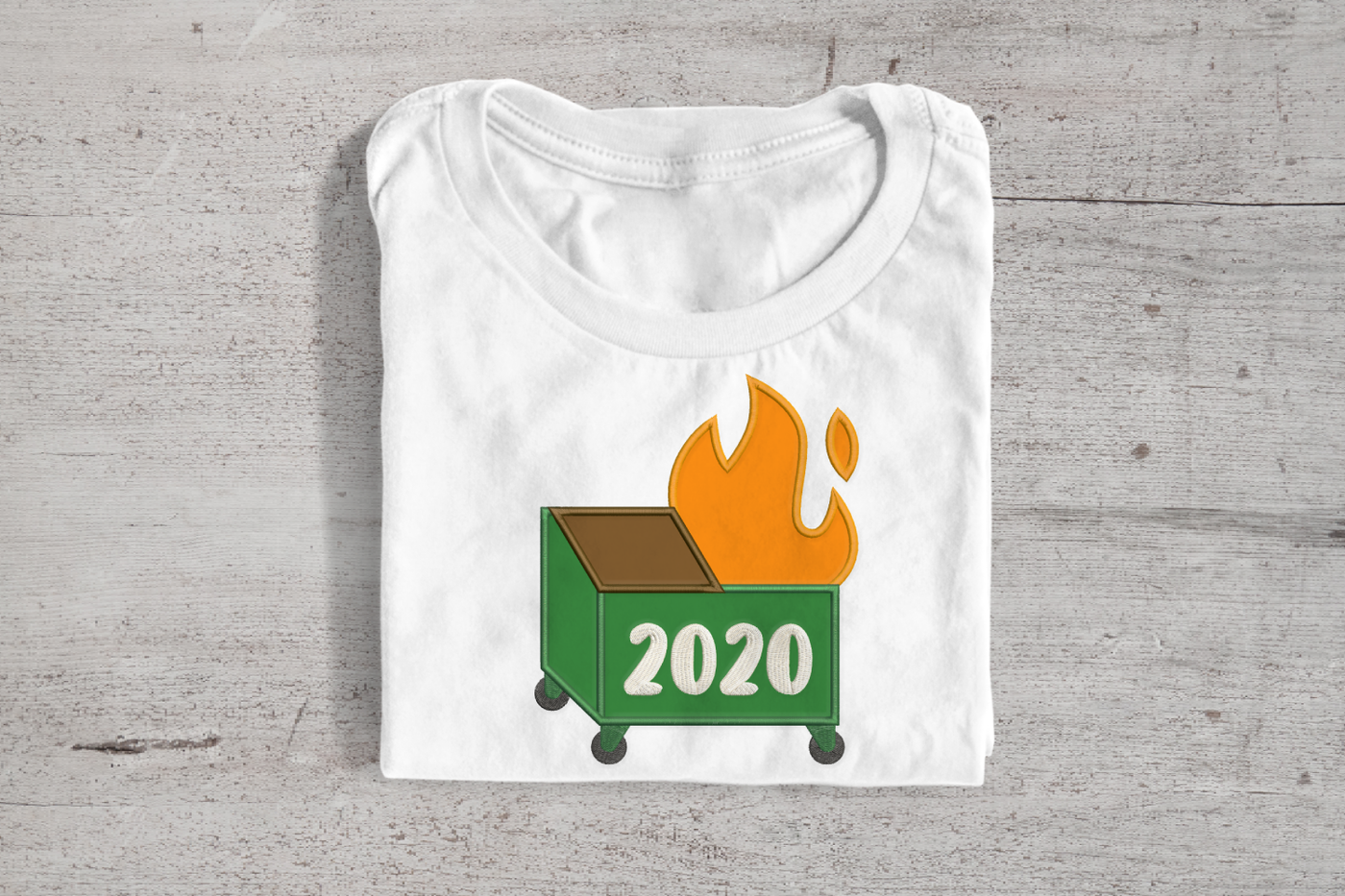Applique of a dumpster fire that says "2020"