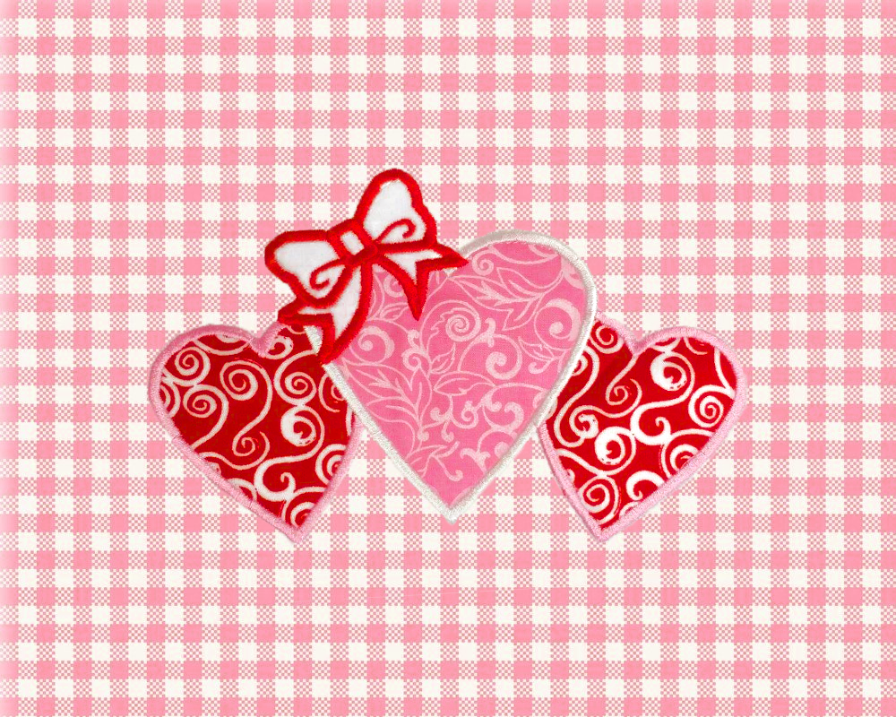 Applique of 3 hearts with a bow