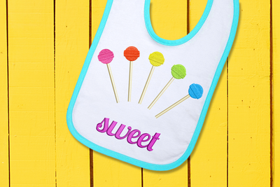 5 embroidered lollipops fanned out with the word "sweet" below