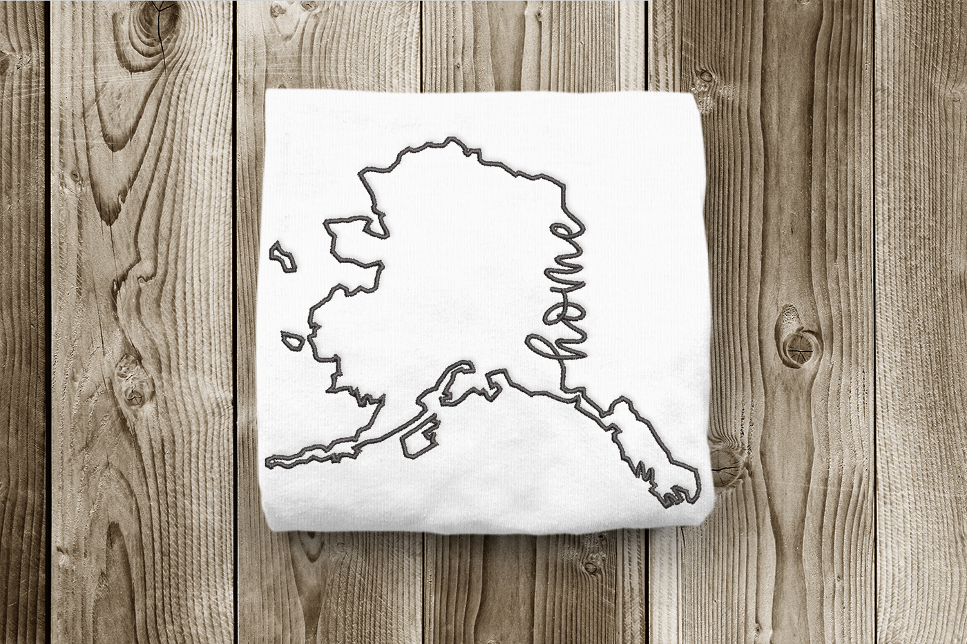 Alaska outline design in satin stitch