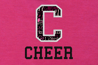 Pink fabric with the word "CHEER" embroidered onto it. Above is an applique letter C.
