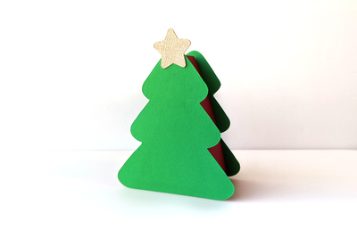Gift box SVG design in the shape of a Christmas tree with a gold star.