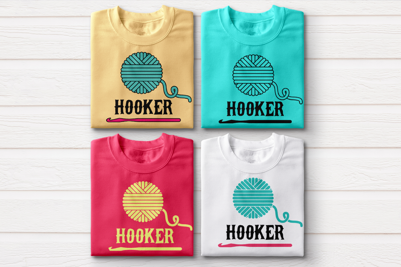 Four folded sweatshirts. Each has a ball of yarn with a crochet hook below and the word "HOOKER"