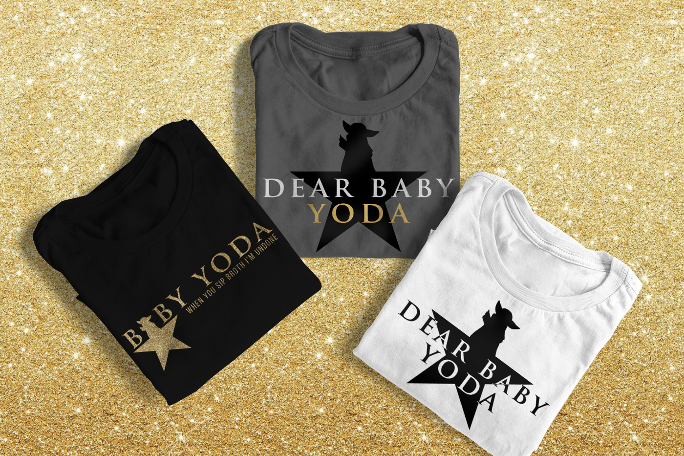 Three folded tees. Two have a star where a baby alien is the top of the star and the words "Dear baby Yoda" across it. The third tee has the same star with the word "Baby Yoda" and the star makes the first A. Under the words it says "when you sip broth I'm undone."
