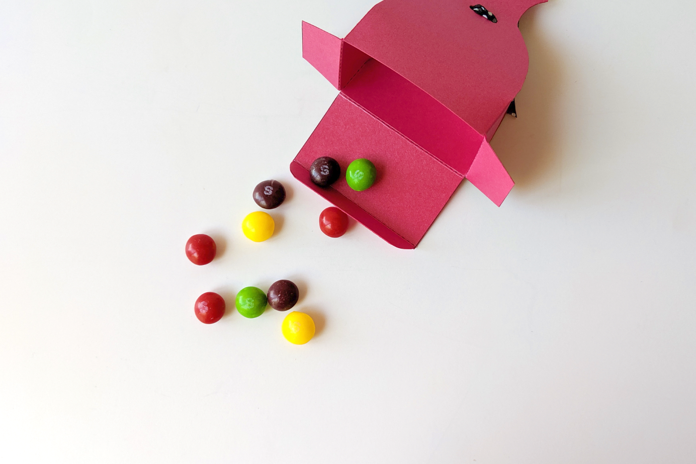 Open dress box with candy spilling out