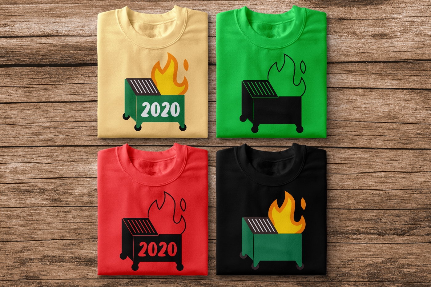 Four folded shirts, each with a dumpster fire design. Some say "2020" on the dumpster. Single color and multi-color versions are represented.