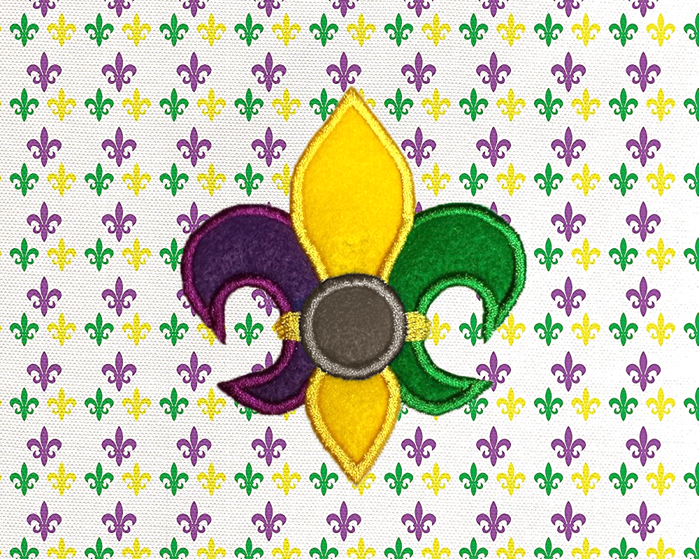 Fleur de lis applique design in purple, yellow, and green. There is a circle in the center in grey for adding a monogram.