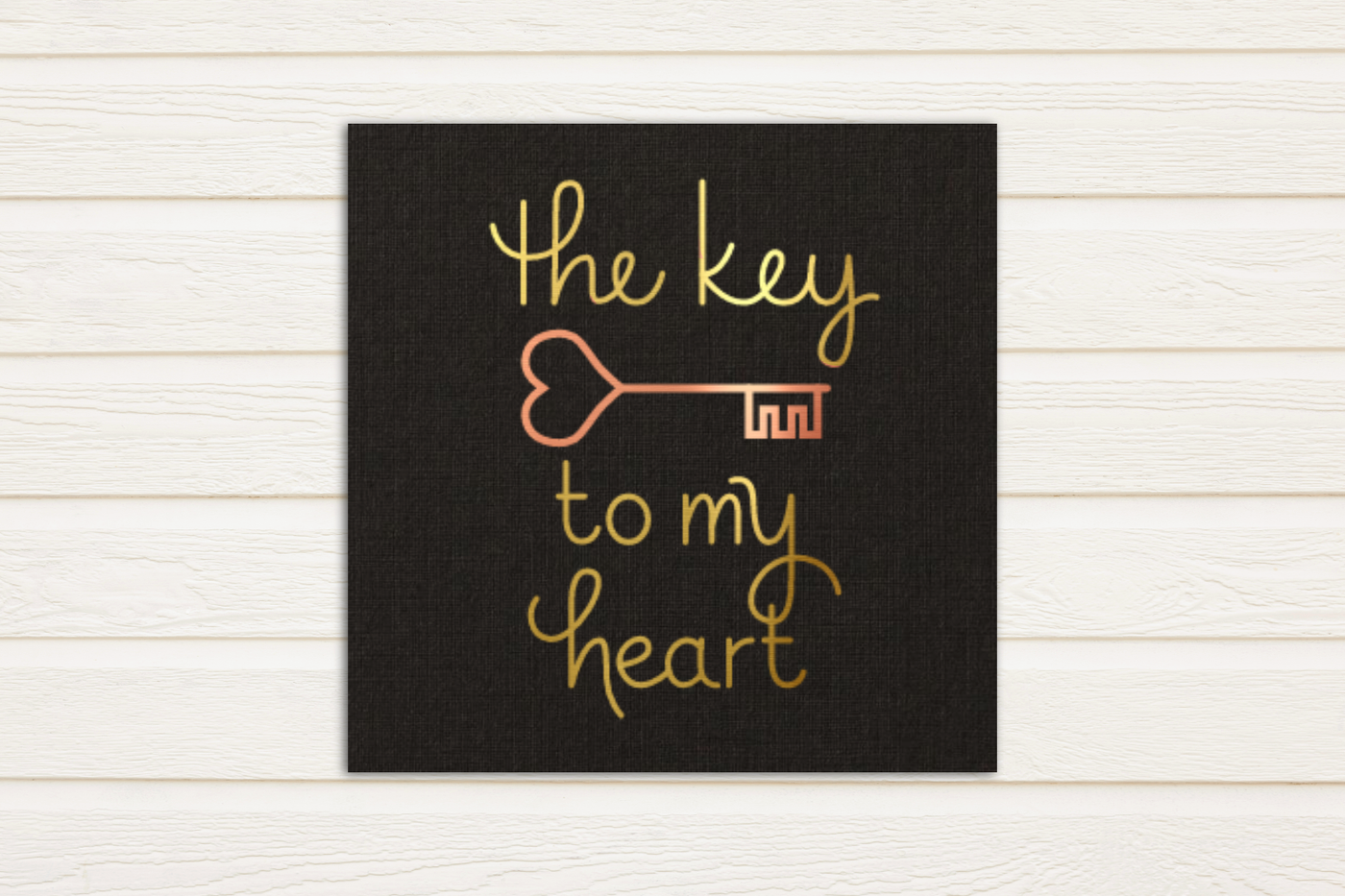 Single line sketch design that says "the key to my heart" with a heart shaped skeleton key. Done in gold and copper foil.