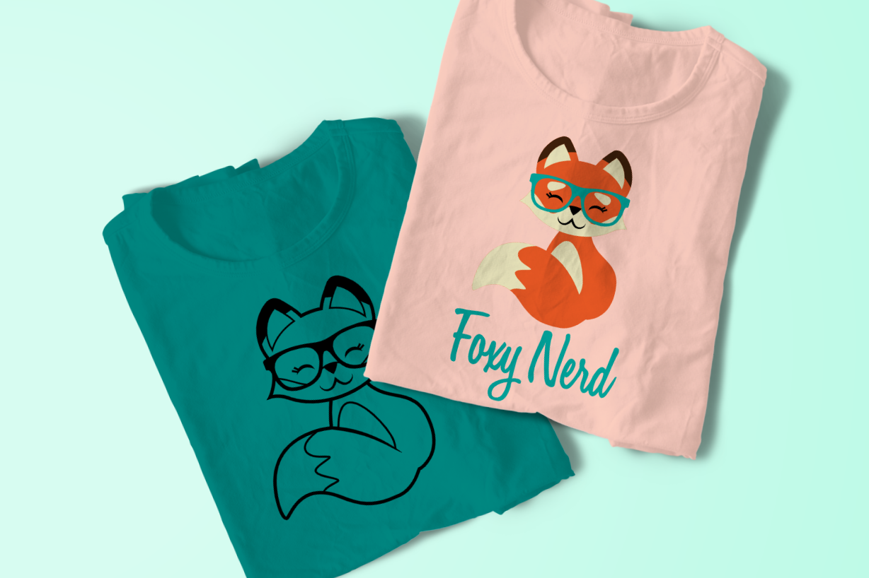 Two folded tees. Each has the design of a smiling fox wearing glasses. One says "foxy nerd" below
