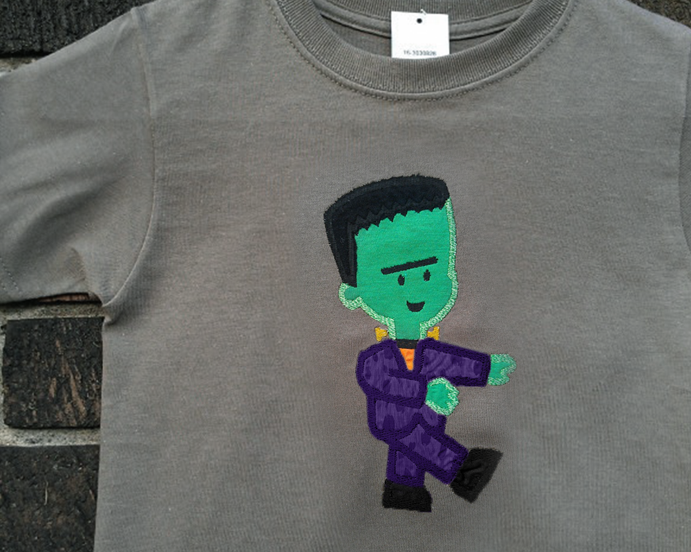 Frankenstein's monster applique on a grey shirt.