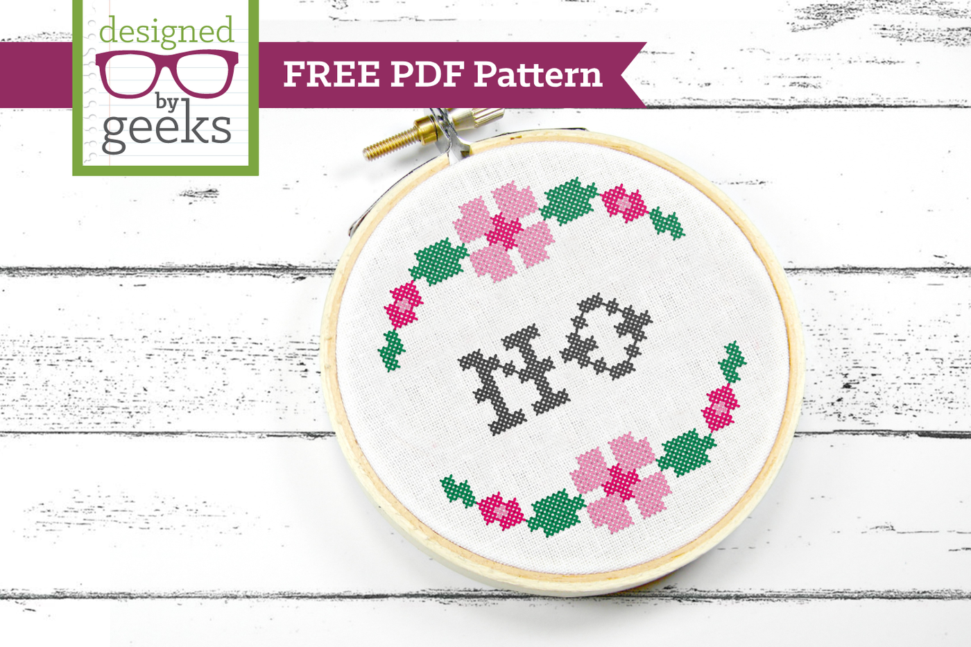 Free PDF cross stitch pattern of a NO with a floral border
