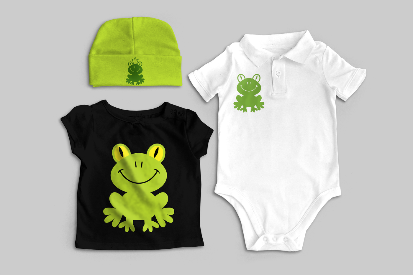 Baby clothes, each with a frog design.