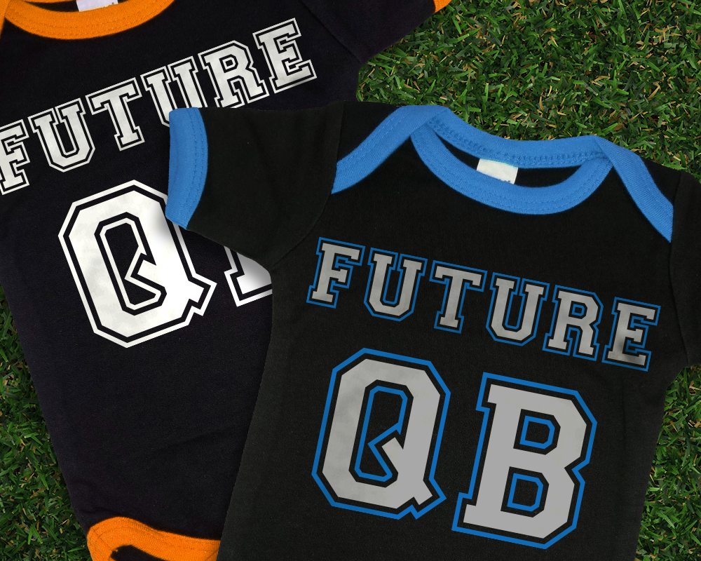 Two black ringer baby onesies. The design says "Future QB" in sports lettering.