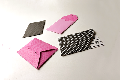 4 different gift card sleeves in pretty patterned paper.