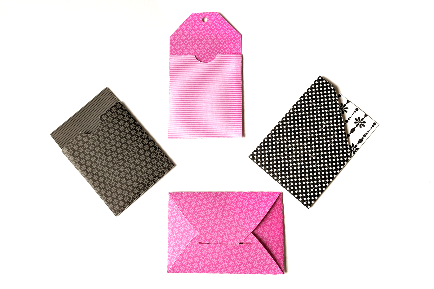 4 different gift card sleeves in pretty patterned paper.