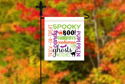 Yard flag with subway word art design. Features words related to Halloween. Also includes a bat, a cat, a candy corn, and a spiderweb nestled within the words.
