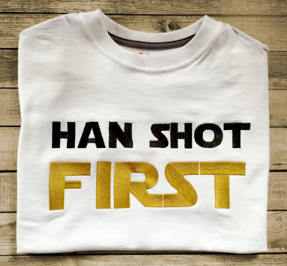 Folded tee with embroidered "Han Shot First" in black and gold