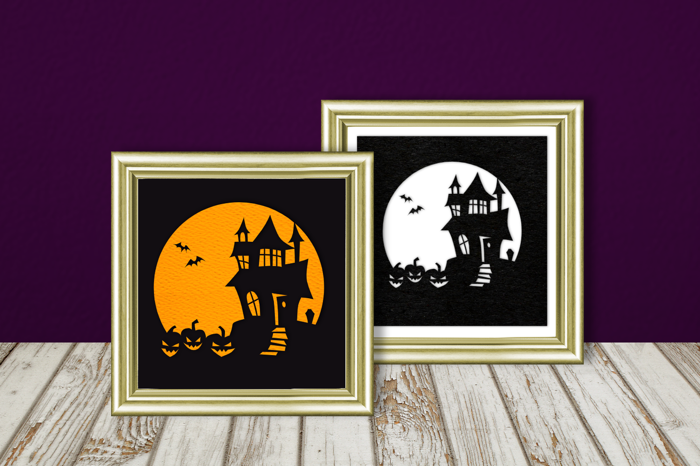 Silhouette of a haunted house against a large full moon