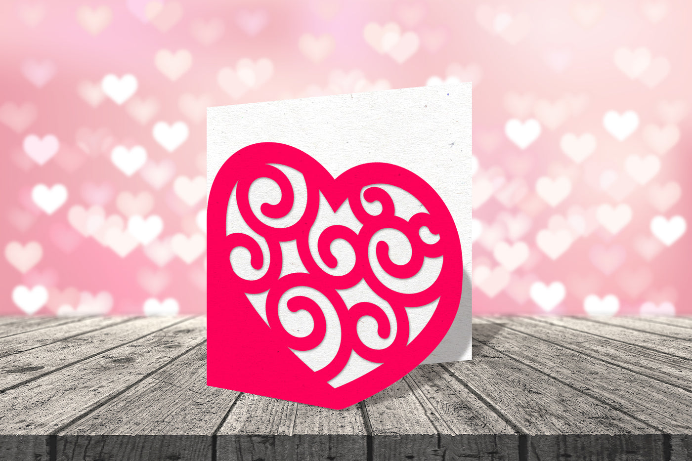 Layered card design of heart with swirls