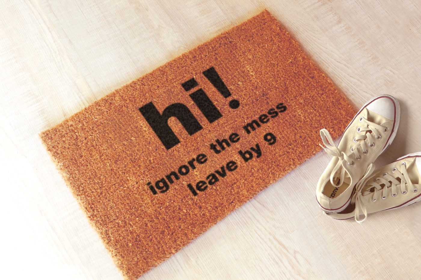 Doormat that says "hi! ignore the mess leave by 9"