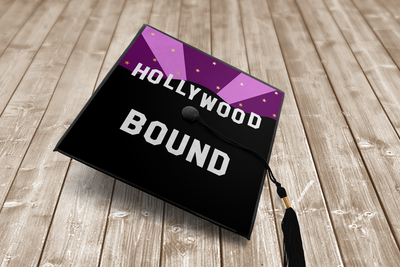 Graduation cap with design that says "Hollywood bound" with a starry night sky and hill silhouette.