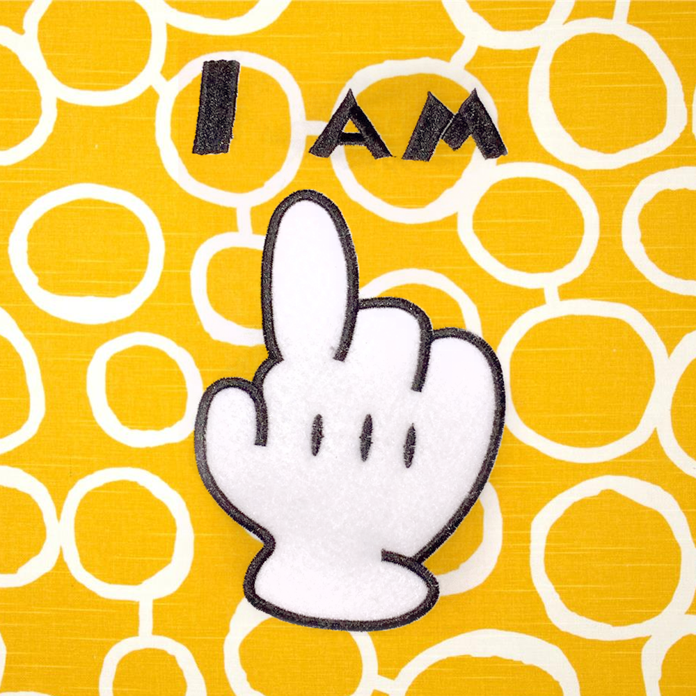 Toon applique glove holding up 1 finger and words "I am"