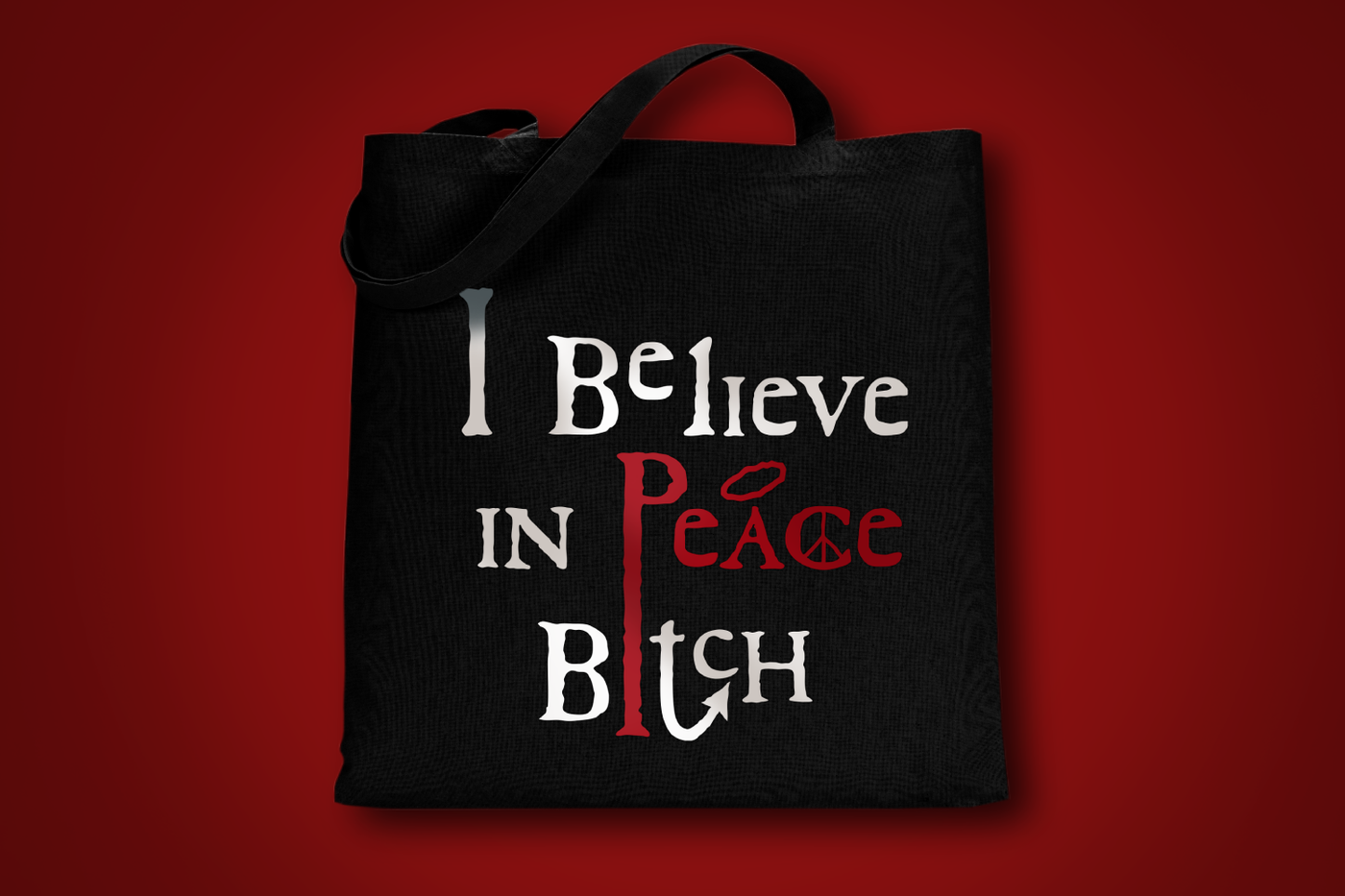 A tote bag that says "I believe in Peace Bitch."