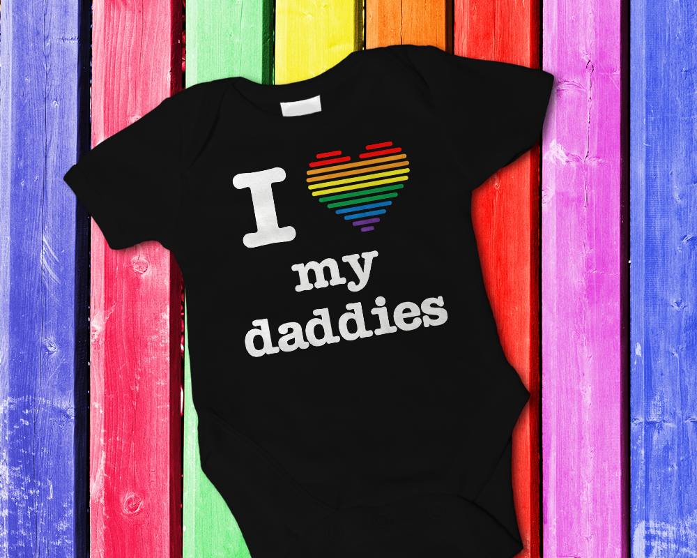 Baby onesie that says "I heart my daddies."  The heart is made out of stripes in pride flag colors.