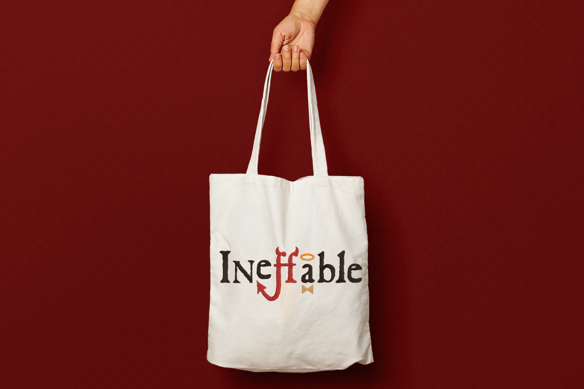 Tote bag with the word "Ineffable" embroidered onto it. The fs have devil horns and a tail, and the a has a halo and bow tie.
