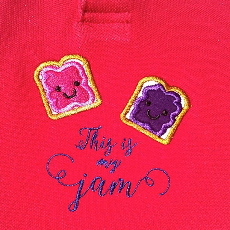 Two applique pieces of bread with jam that say "this is my jam"