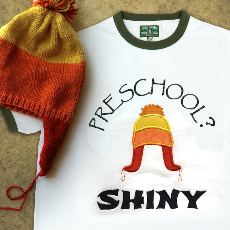 Applique winter hat with embroidered words that say "Preschool? Shiny."