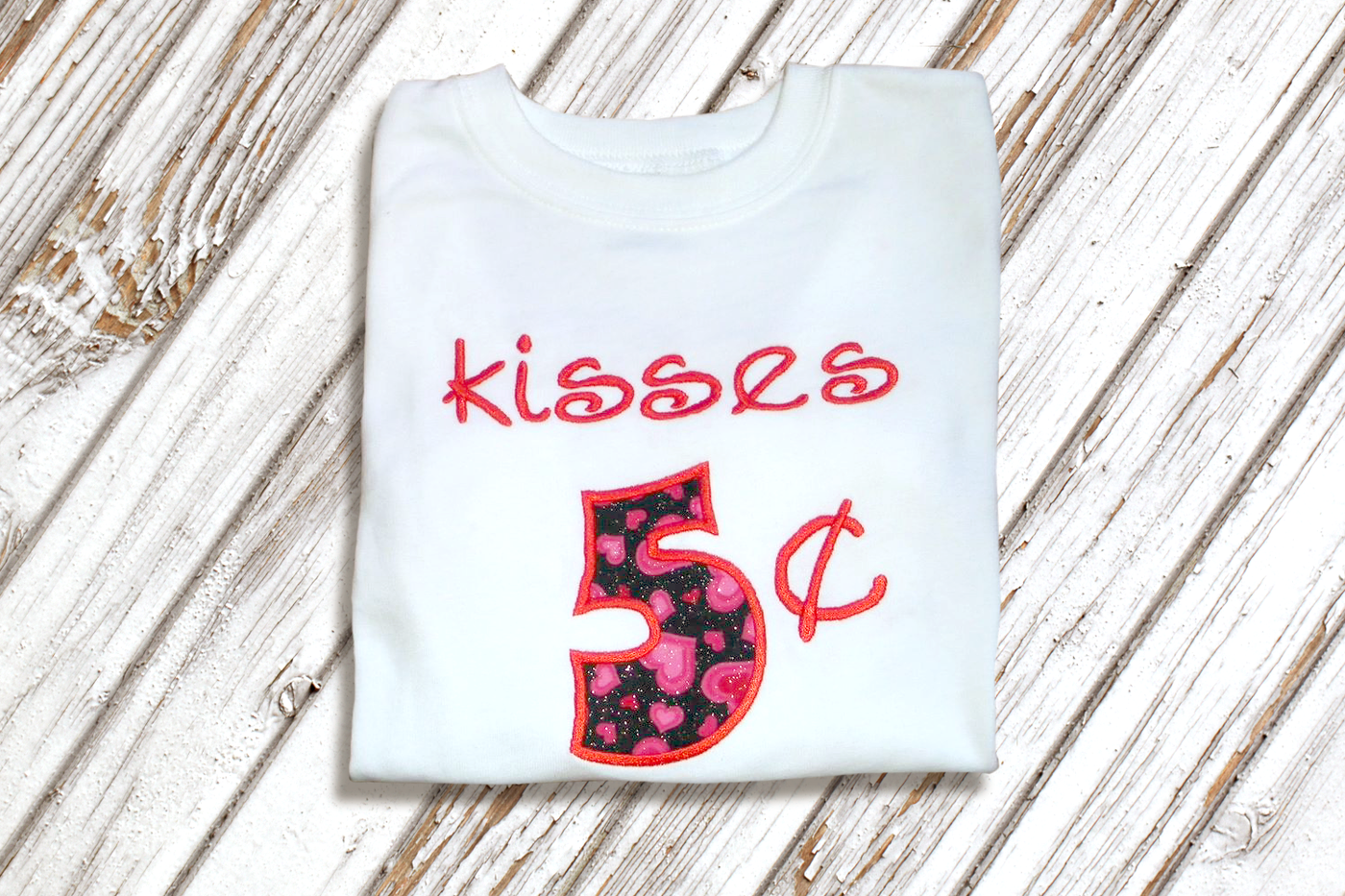 Applique design that says "kisses 5 cents"