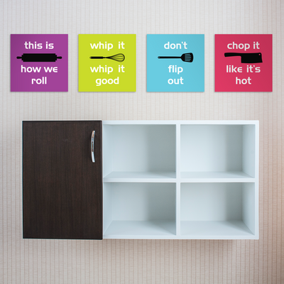 Four posters hanging above a cabinet. Each has a different kitchen tool with a punny phrase.