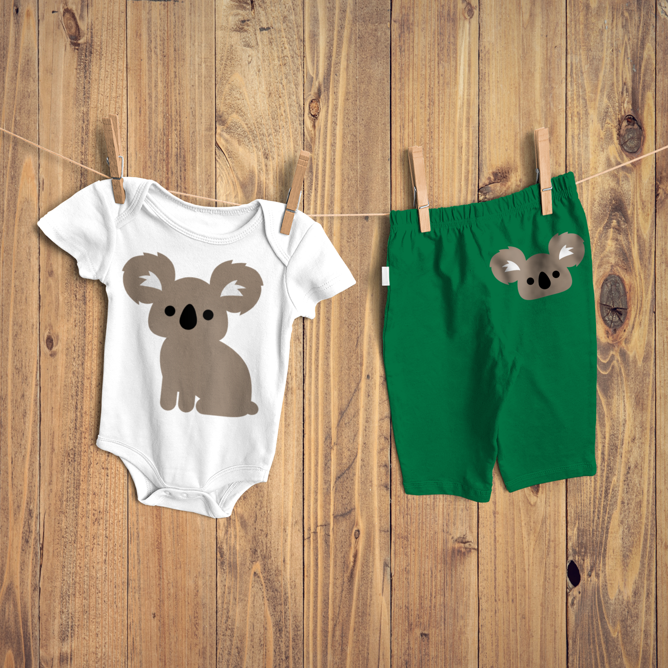 Onesie with a koala design, and baby pants with a koala face design.