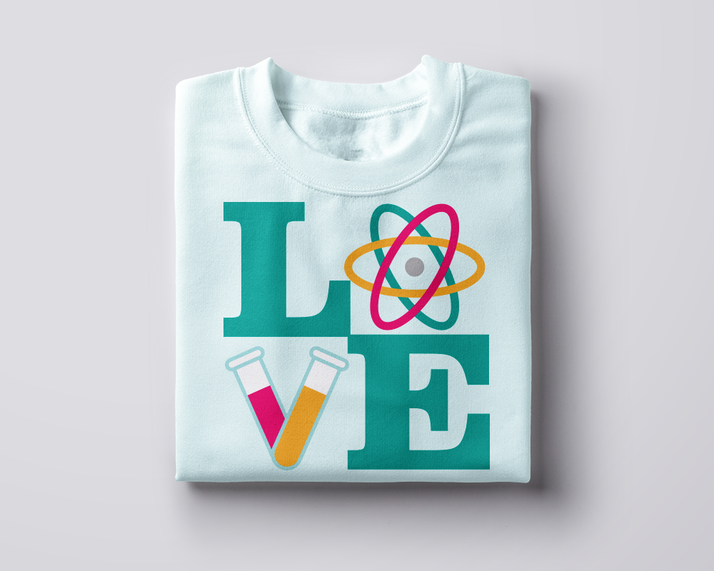 Folded shirt with "LOVE" set square. In place of the O is an atom, in place of the V are two test tubes at an angle.