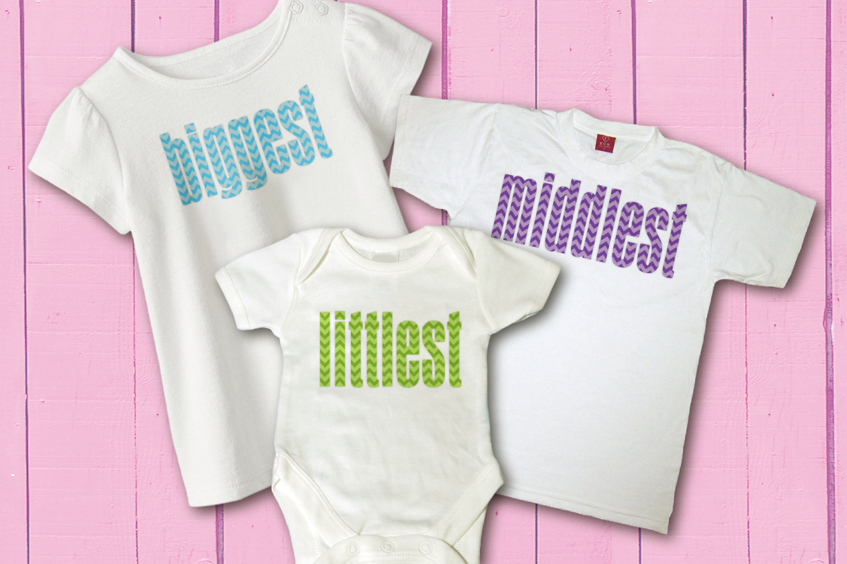 Three shirts for various ages in white. The smallest shirt says "littlest," the middle shirt says "middlest" and the largest shirt says "biggset." Each word has a chevron pattern applied.