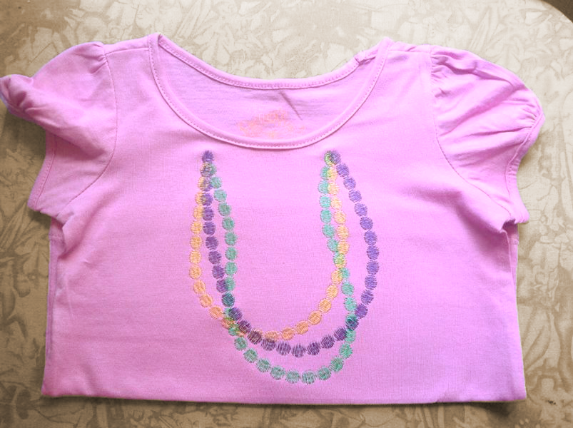 Shirt with embroidered Mardi Gras beads