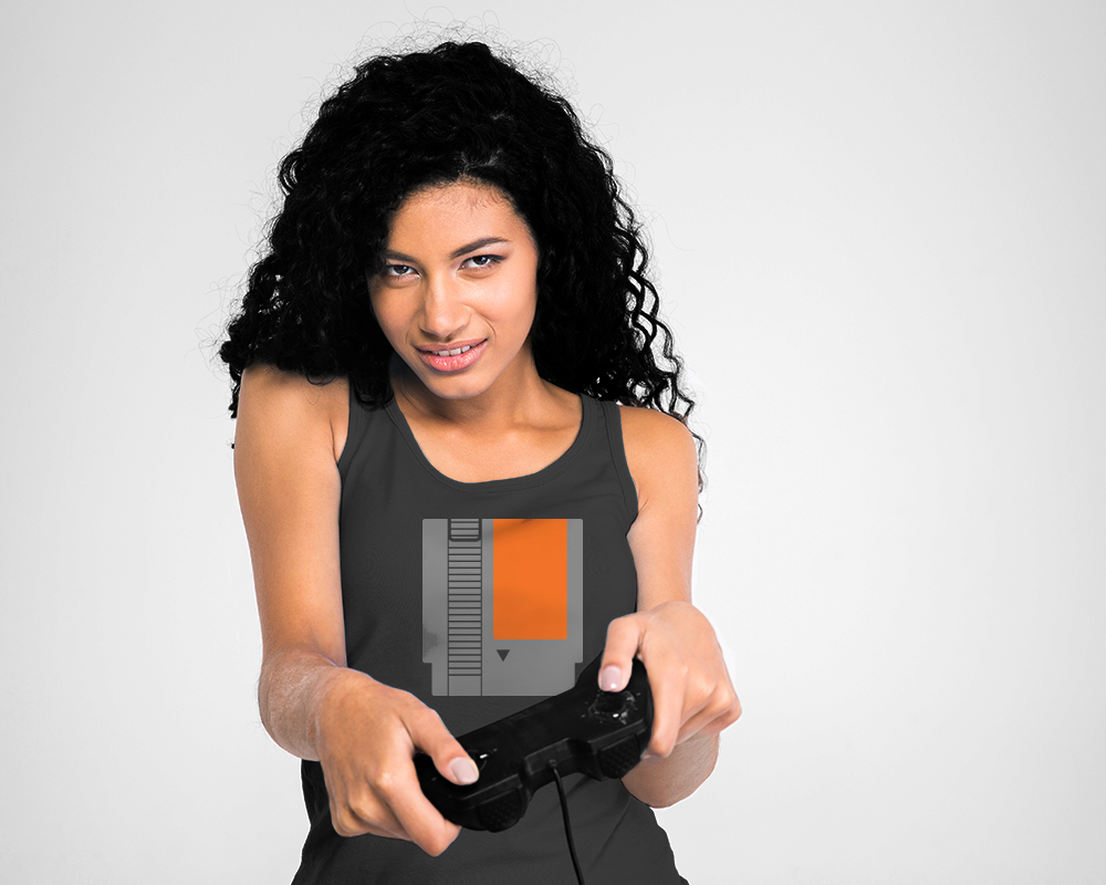 Woman of color holding a video game controller with a video game cartridge design on her shirt