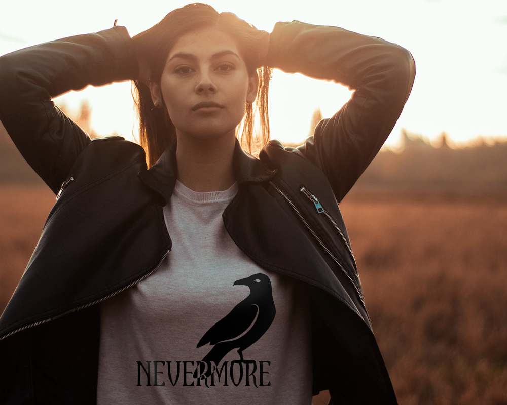 White woman wearing a leather coat and a tee with a raven design that says "nevermore" beneath it.
