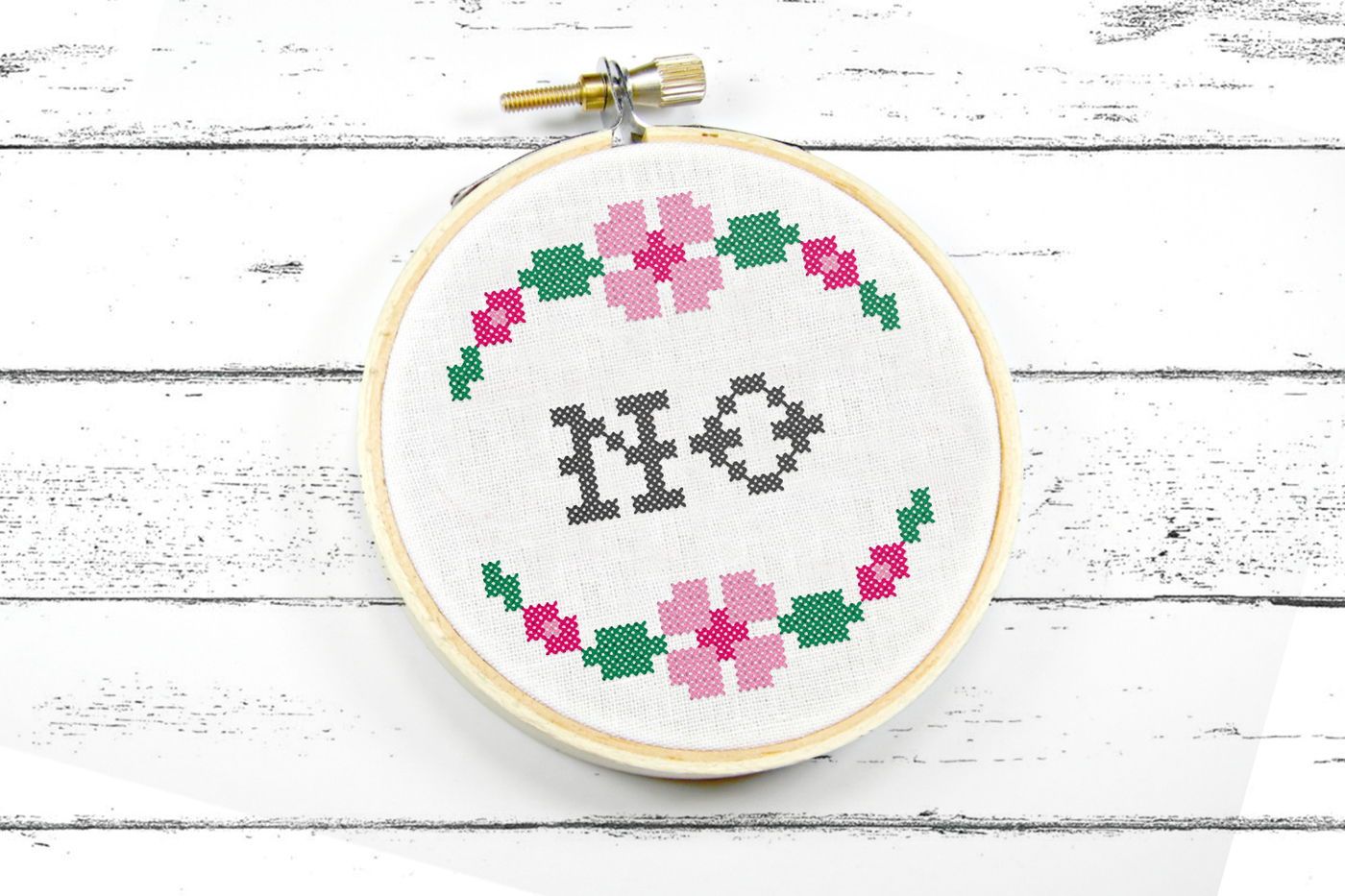 No faux cross stitch machine embroidery design with floral border