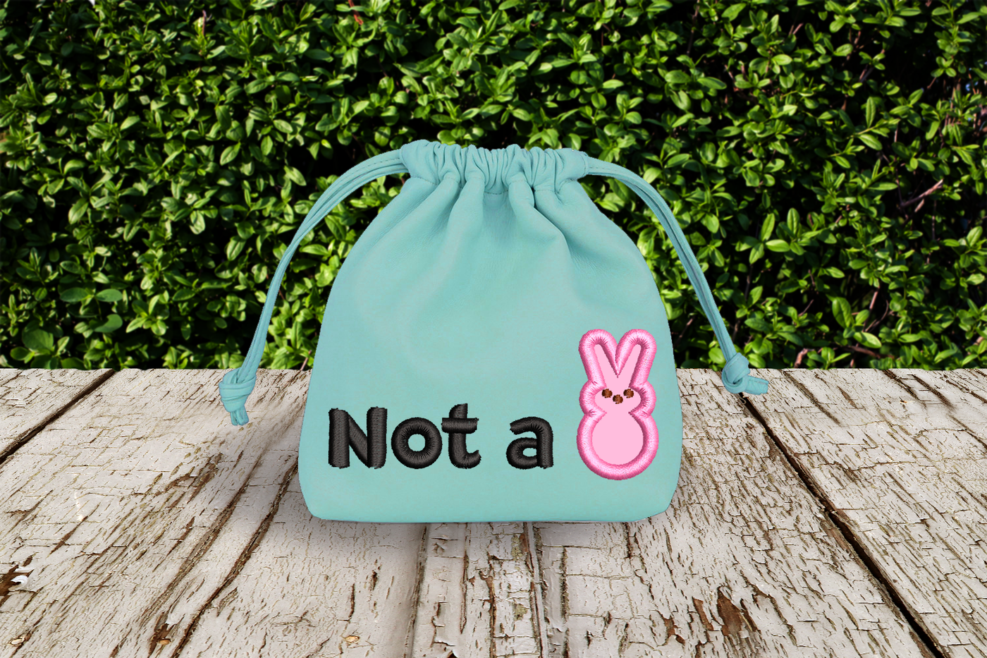 Bag with an applique design that says "Not a" with an applique marshmallow bunny after the words.