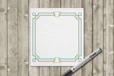 Art deco inspired square border in teal and orange on a white square piece of paper on a wood background. Laying on top is a Cricut brand marker.
